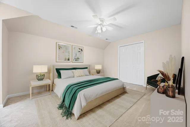 a bedroom with a bed and dresser