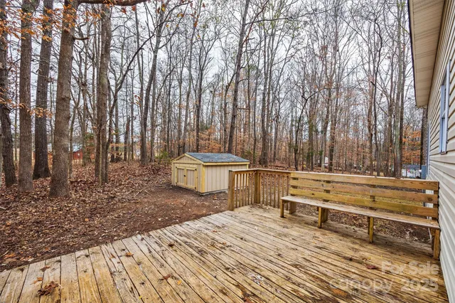 a front view of house with yard and trees
