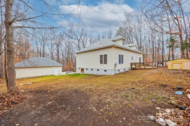 a view of hallway with wooden floor