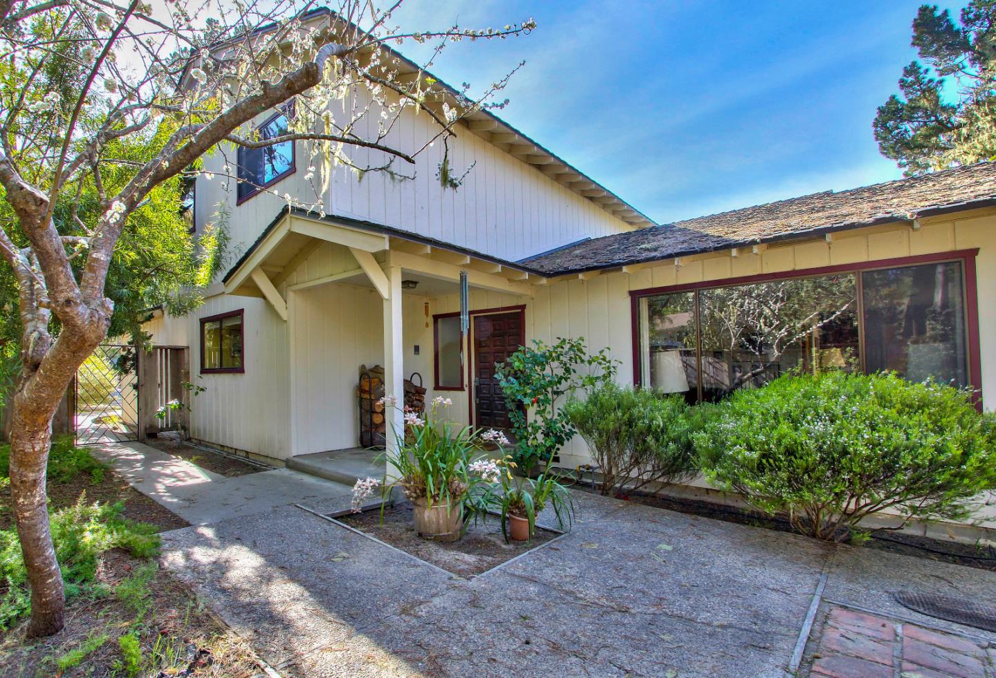 3036 Sloat Road Pebble Beach, CA 93953 - Photo 1 of 22 a front view of a house with garden