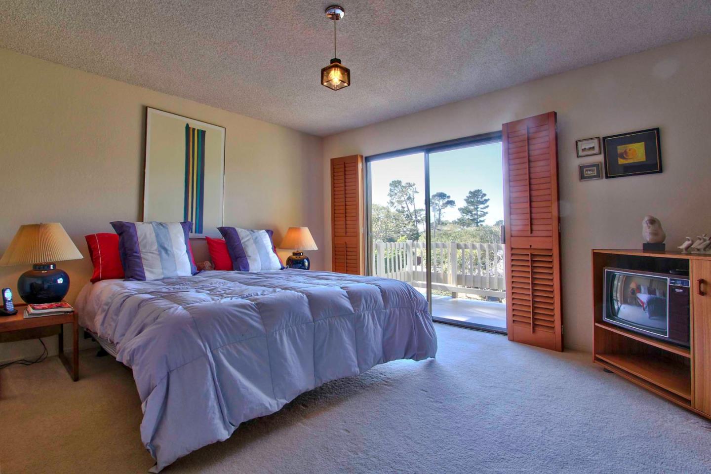 3036 Sloat Road Pebble Beach, CA 93953 - Photo 12 of 22 a bed room with a bed and a tv