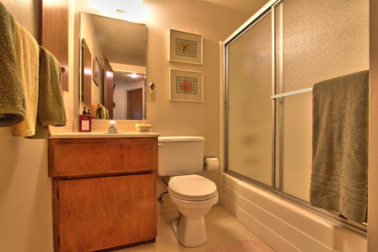 3036 Sloat Road Pebble Beach, CA 93953 - Photo 15 of 22 a bathroom with a toilet a sink and shower
