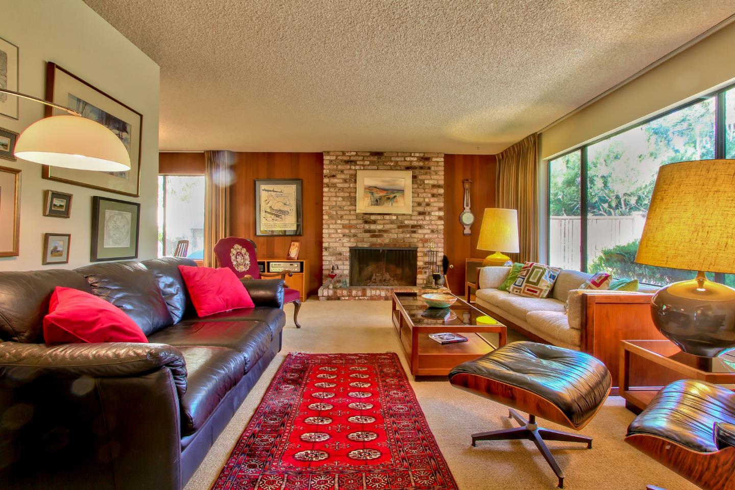 3036 Sloat Road Pebble Beach, CA 93953 - Photo 2 of 22 a living room with furniture fireplace and a large window