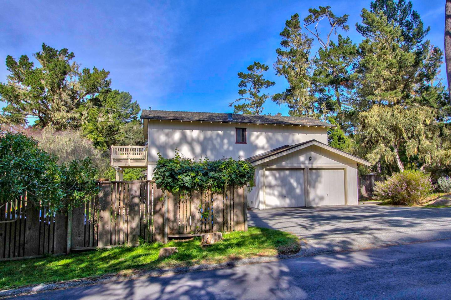 3036 Sloat Road Pebble Beach, CA 93953 - Photo 22 of 22 a front view of a house with a garden