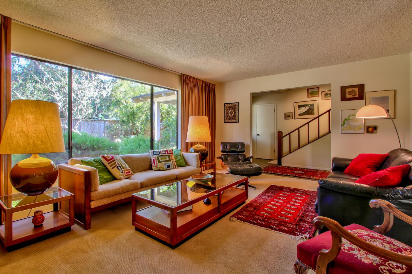3036 Sloat Road Pebble Beach, CA 93953 - Photo 4 of 22 a living room with furniture and a floor to ceiling window
