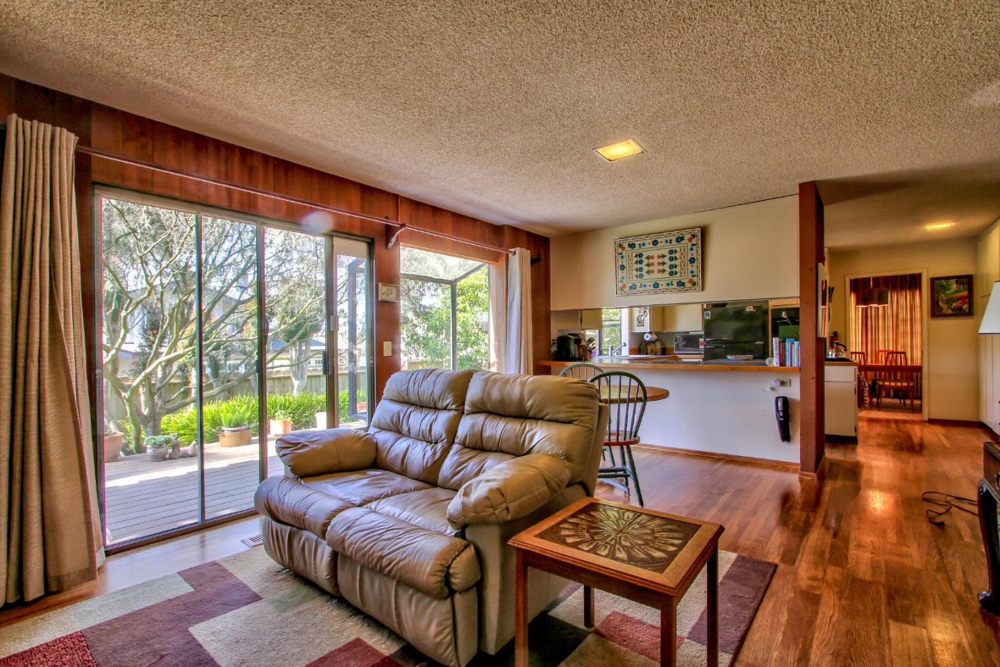 3036 Sloat Road Pebble Beach, CA 93953 - Photo 10 of 22 a living room with furniture and a large window