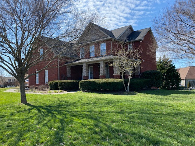 1202 White Rock Road Spring Hill, TN 37174 - Photo 1 of 2 a view of a house next to a big yard and large trees