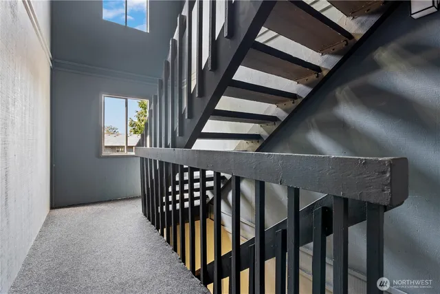 a view of entryway with stairs and wooden floor