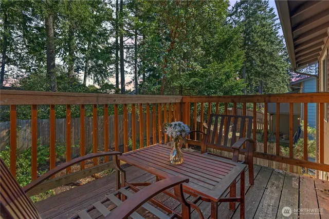 a view of a wooden deck with a bench