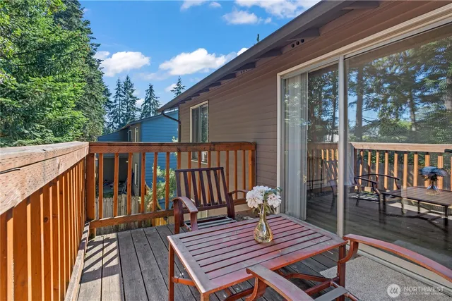 a view of a wooden deck with a bench