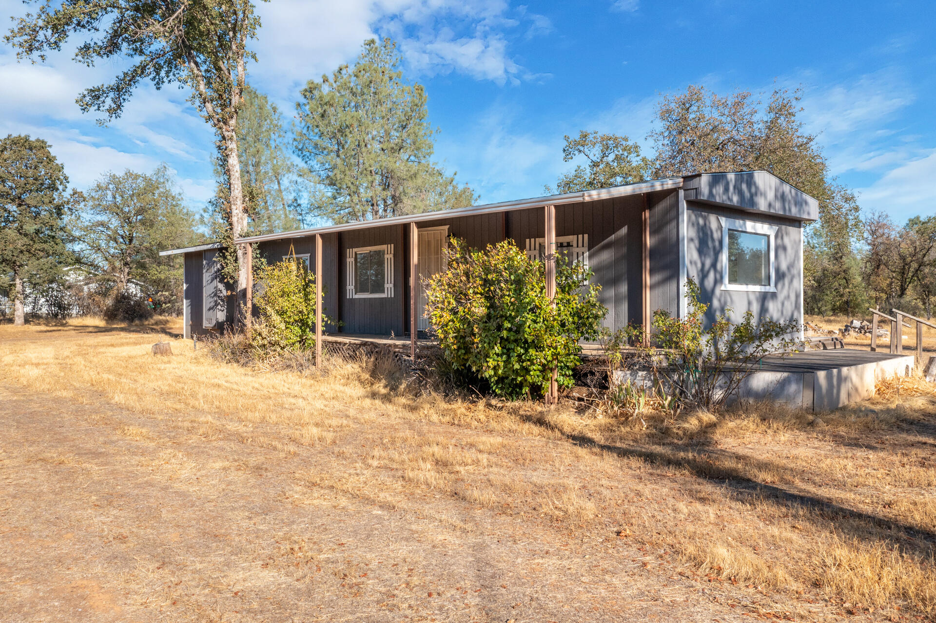17594 Oly Way Anderson, CA 96007 - Photo 3 of 29 a front view of a house with garden