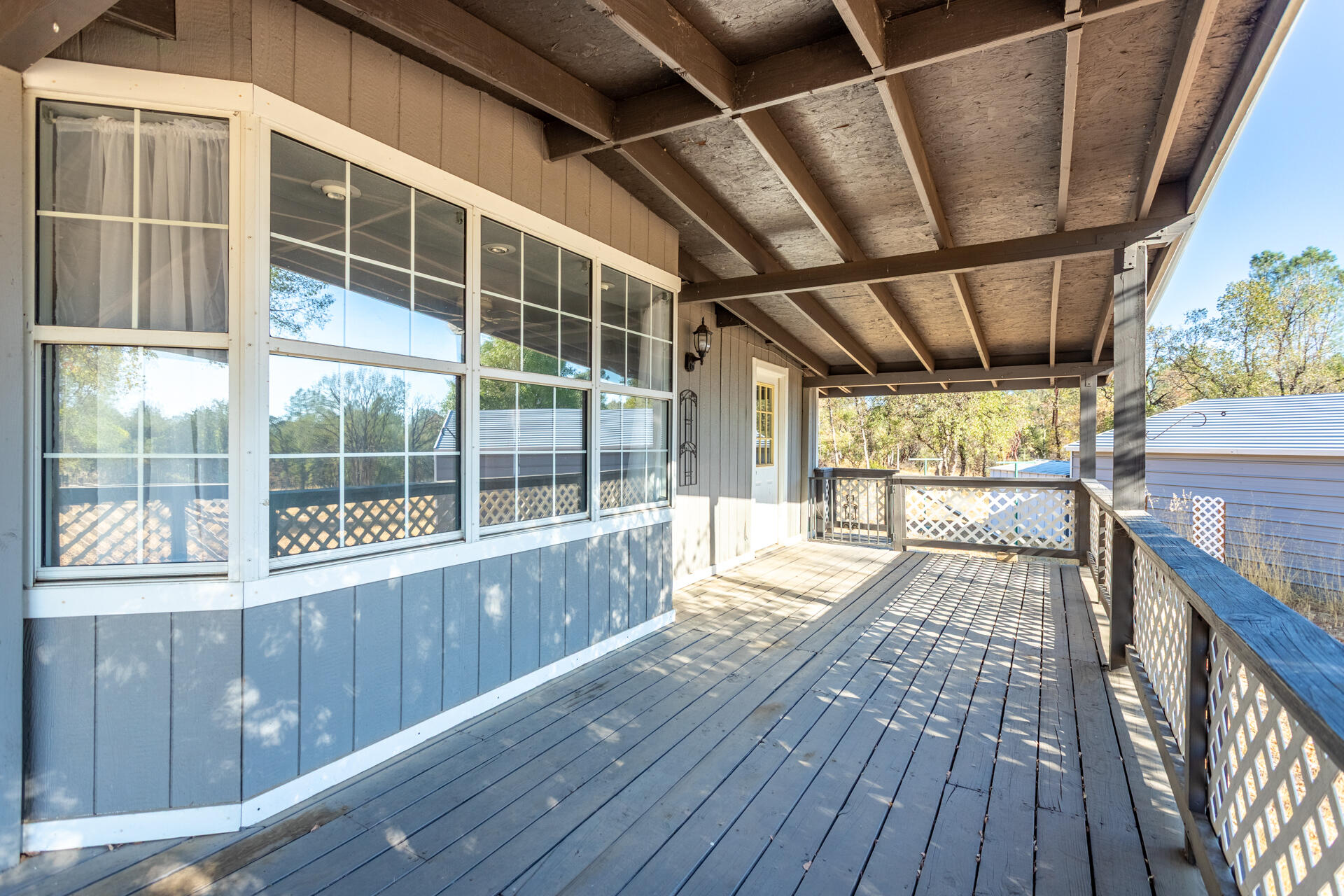 17594 Oly Way Anderson, CA 96007 - Photo 5 of 29 a view of an empty room with wooden floor and a window