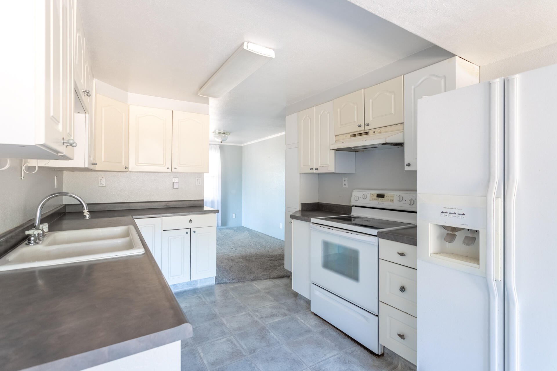 17594 Oly Way Anderson, CA 96007 - Photo 7 of 29 a kitchen with stainless steel appliances granite countertop a sink stove and refrigerator
