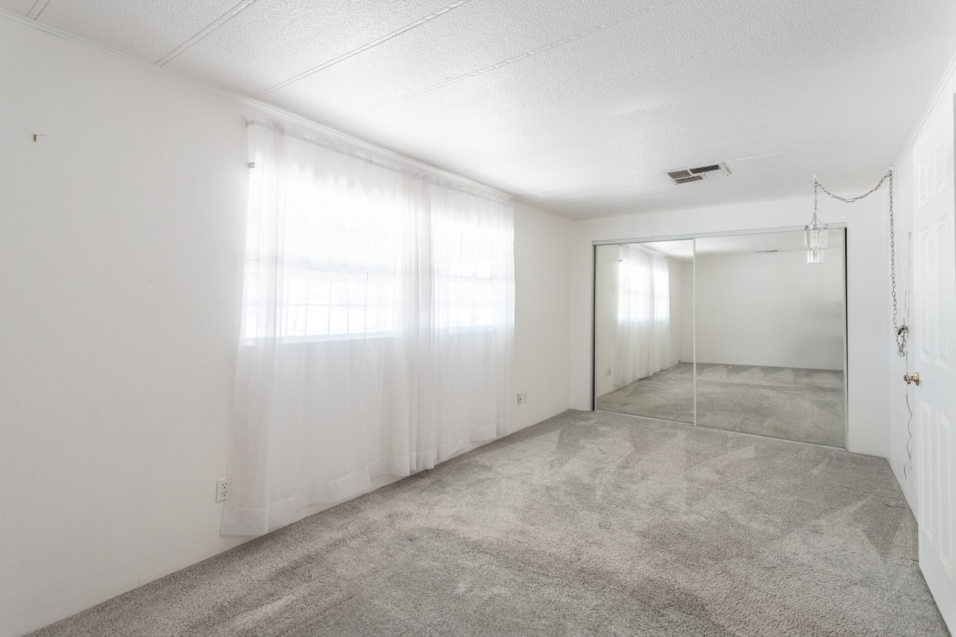 17594 Oly Way Anderson, CA 96007 - Photo 10 of 29 a view of an empty room with window and closet area