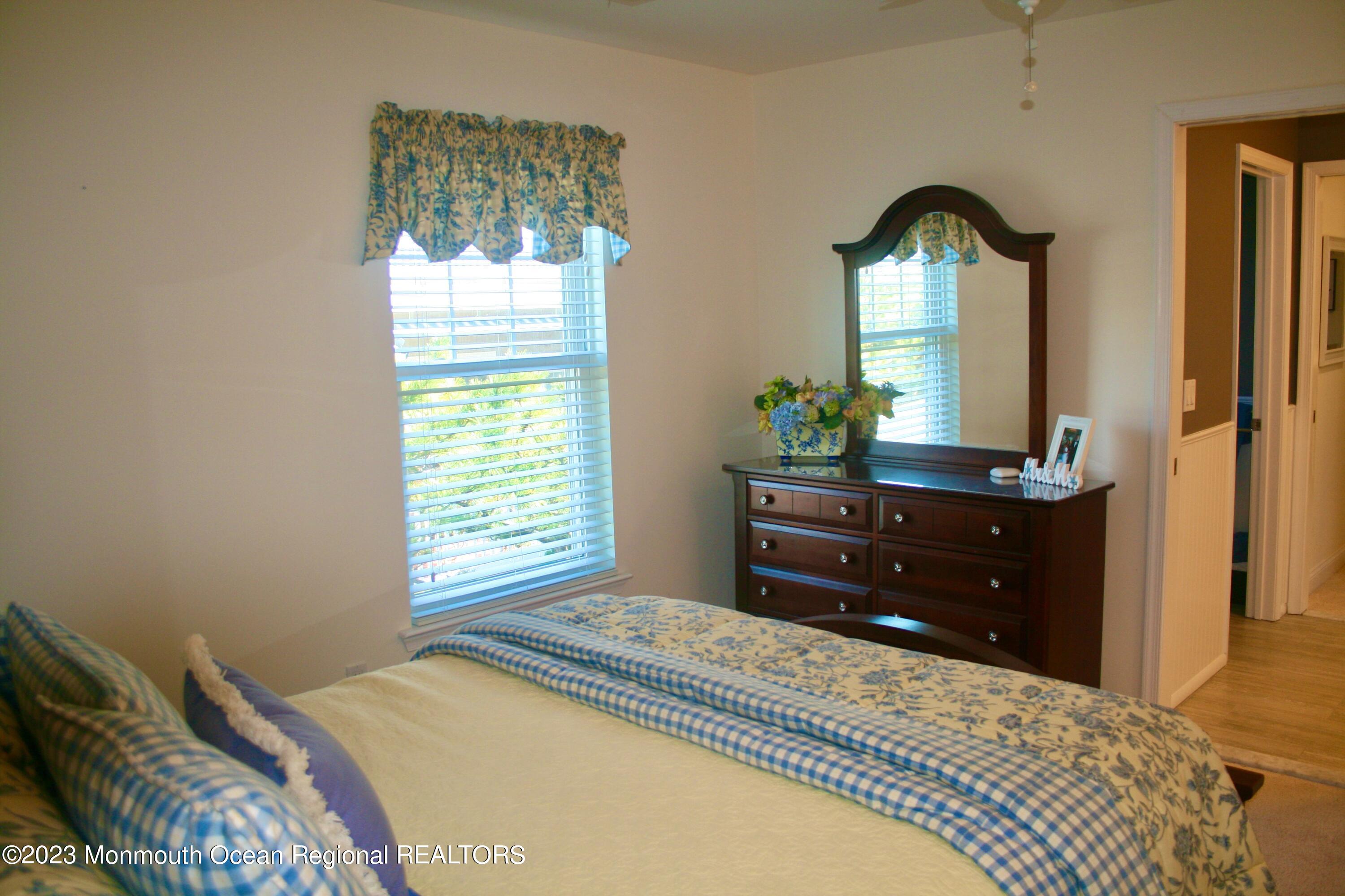 22 Pershing Boulevard Lavallette, NJ 08735 - Photo 18 of 32 a bedroom with a bed and a dresser