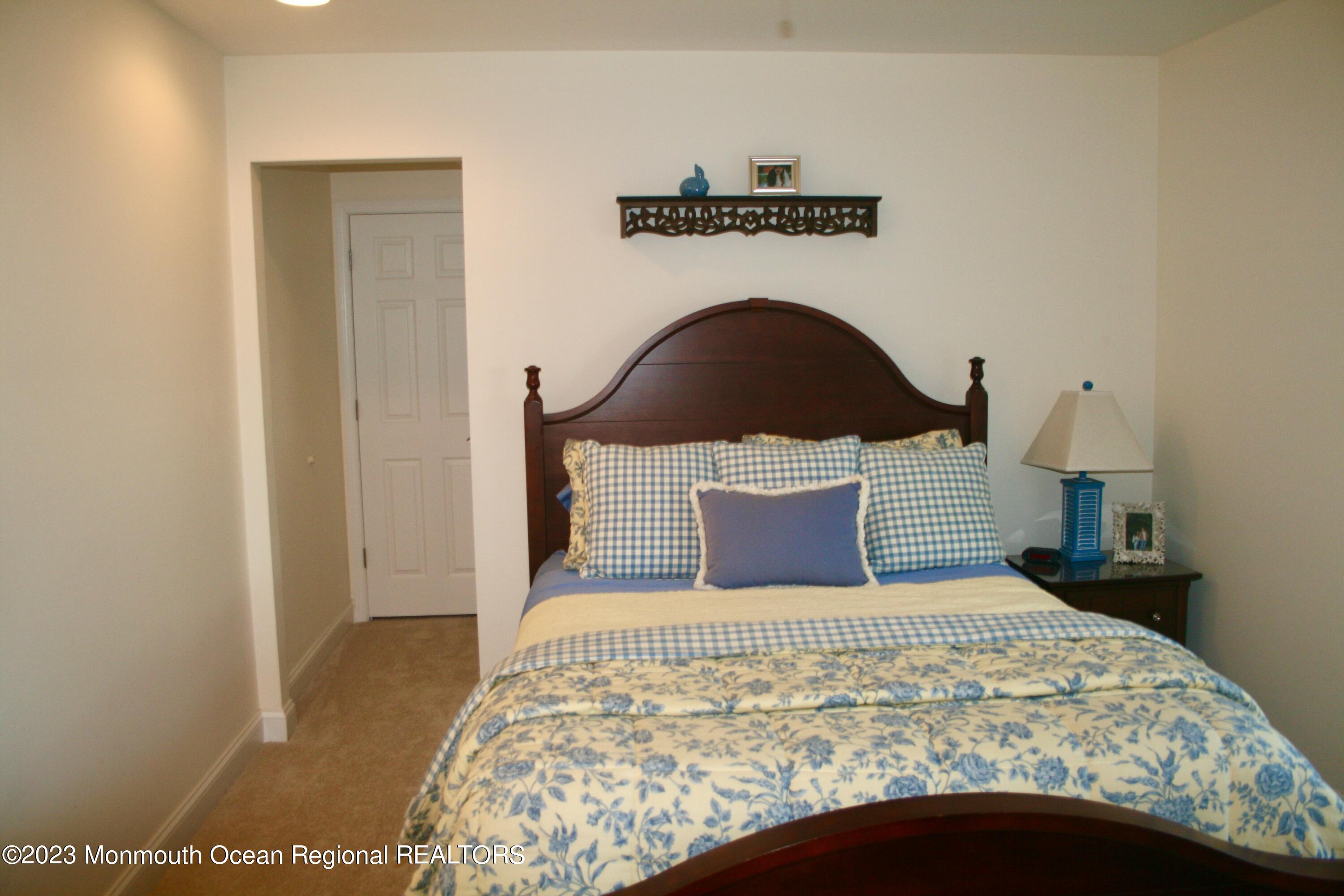 22 Pershing Boulevard Lavallette, NJ 08735 - Photo 19 of 32 a bedroom with a bed and a window