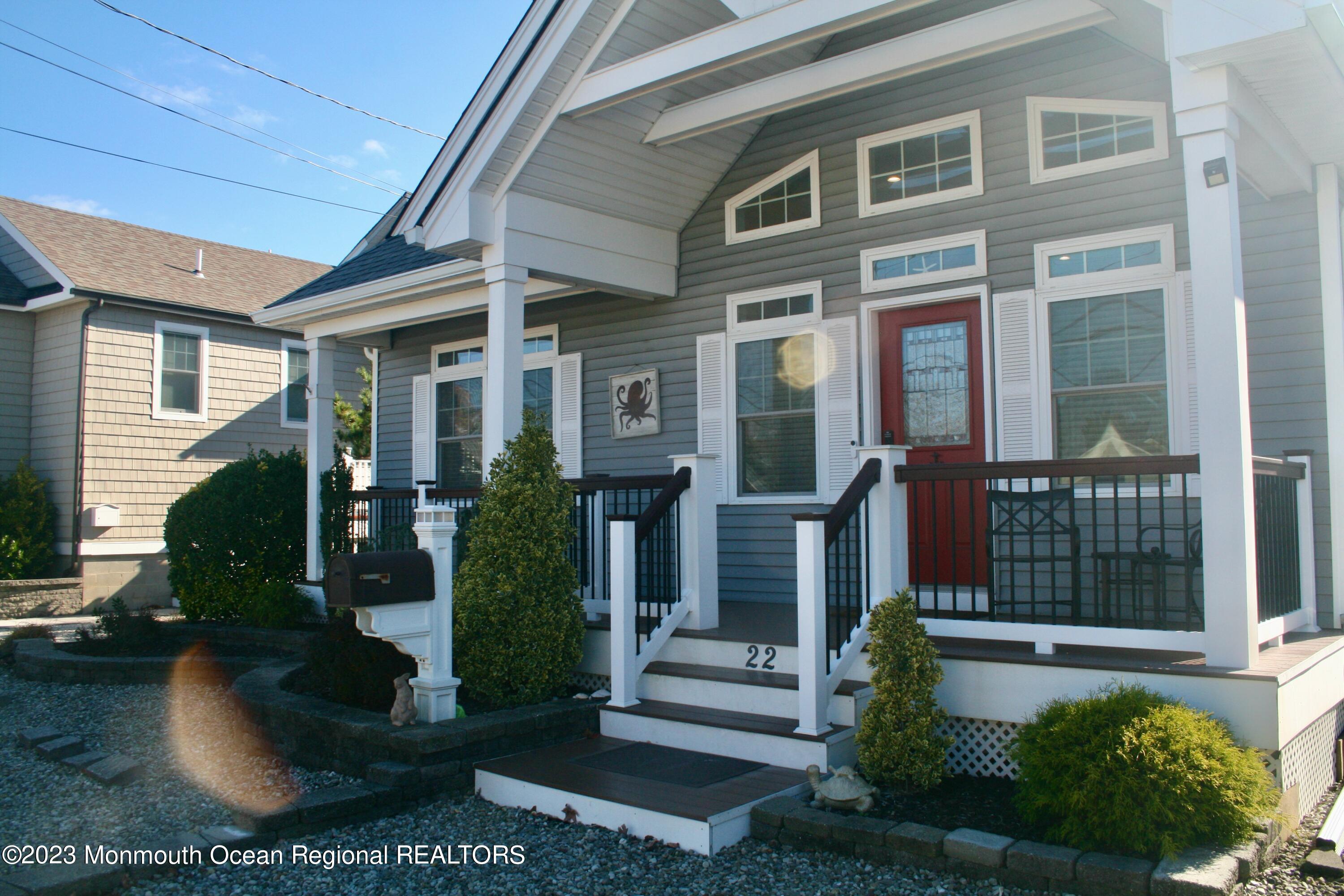 22 Pershing Boulevard Lavallette, NJ 08735 - Photo 2 of 32 a front view of a house with garden
