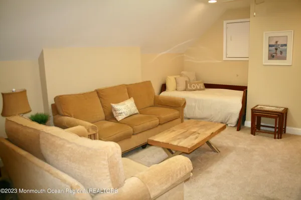 a bedroom with a bed and two night stand