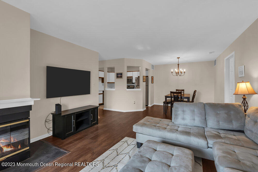 2206 Candlelight Court, Unit 2206 Helmetta, NJ 08828 - Photo 24 of 38 a living room with furniture and a flat screen tv