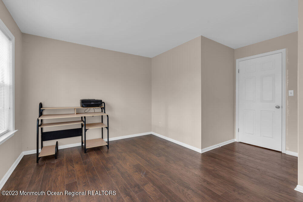2206 Candlelight Court, Unit 2206 Helmetta, NJ 08828 - Photo 29 of 38 a view of workspace with wooden floor lounge chair and windows