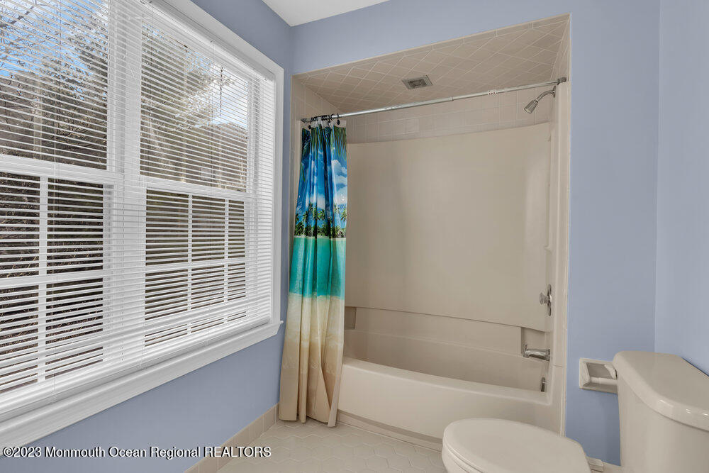 2206 Candlelight Court, Unit 2206 Helmetta, NJ 08828 - Photo 35 of 38 a bathroom with a shower and a toilet