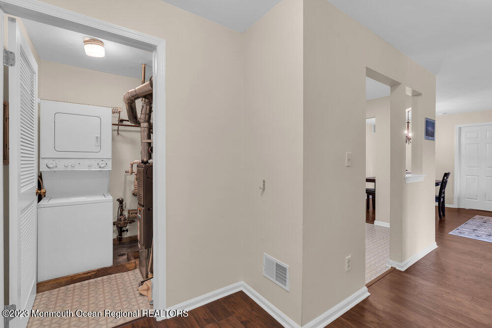 2206 Candlelight Court, Unit 2206 Helmetta, NJ 08828 - Photo 36 of 38 a view of a hallway with closet and wooden floor
