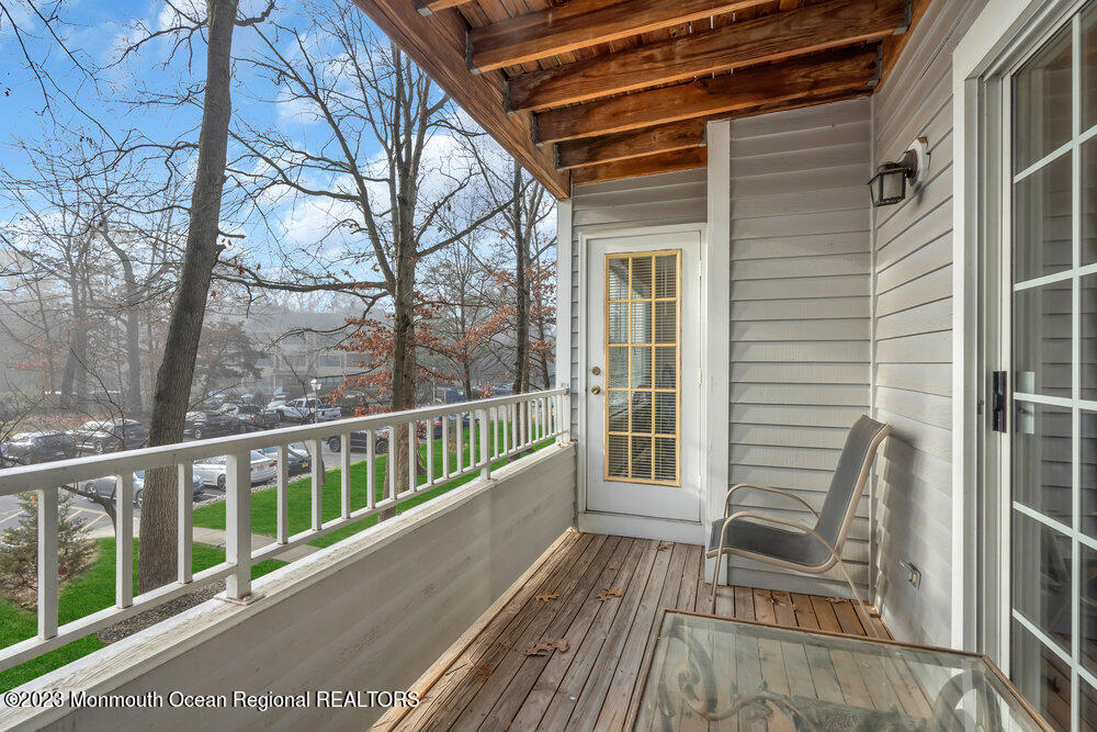 2206 Candlelight Court, Unit 2206 Helmetta, NJ 08828 - Photo 37 of 38 a view of a two chairs in the balcony