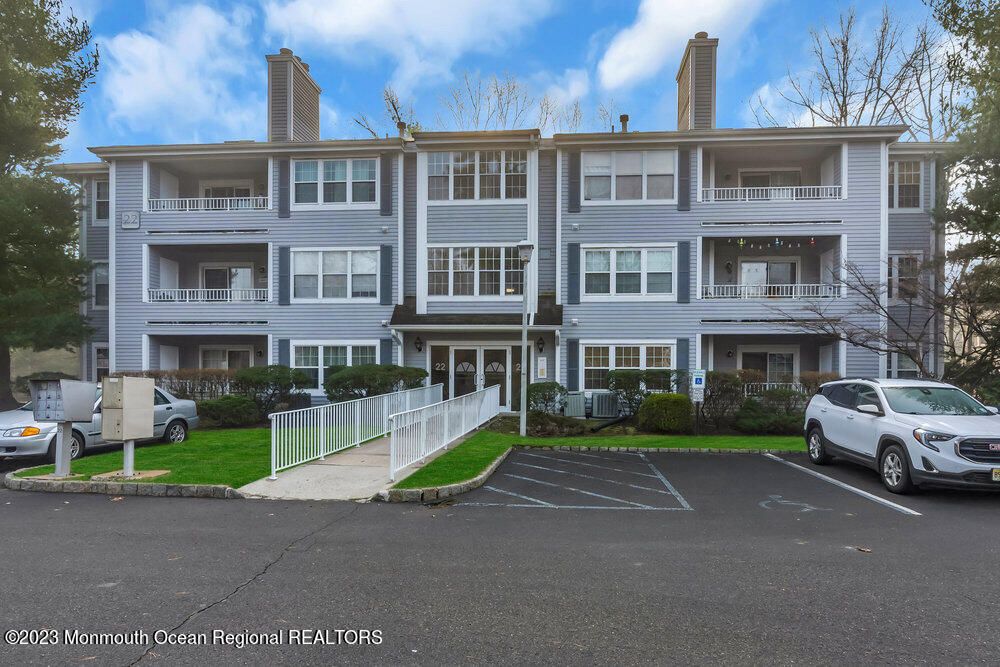 2206 Candlelight Court, Unit 2206 Helmetta, NJ 08828 - Photo 6 of 38 a front view of a building with street
