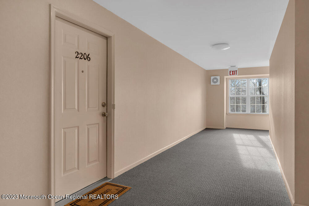 2206 Candlelight Court, Unit 2206 Helmetta, NJ 08828 - Photo 7 of 38 an empty room with windows