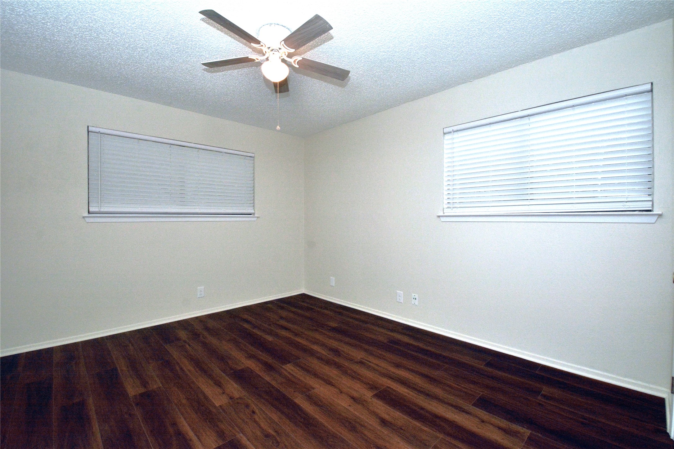 11314 Walnut Ridge Drive, Unit B Austin, TX 78753 - Photo 15 of 19 Rich wood-toned flooring flows through this bright, adaptable living space, ready for your personal touch.