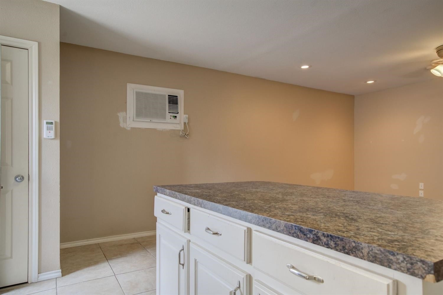 2601 33rd Street, Unit REAR Lubbock, TX 79410 - Photo 12 of 16 a view of kitchen and hall with wooden floor