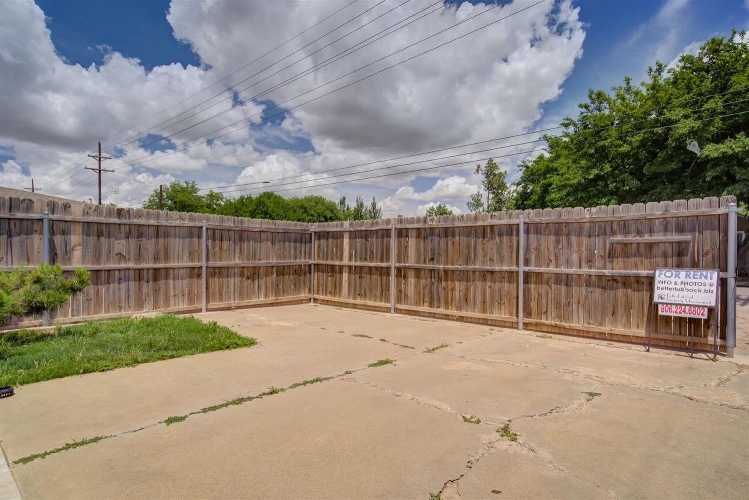 2601 33rd Street, Unit REAR Lubbock, TX 79410 - Photo 14 of 16 a view of a backyard with a fence