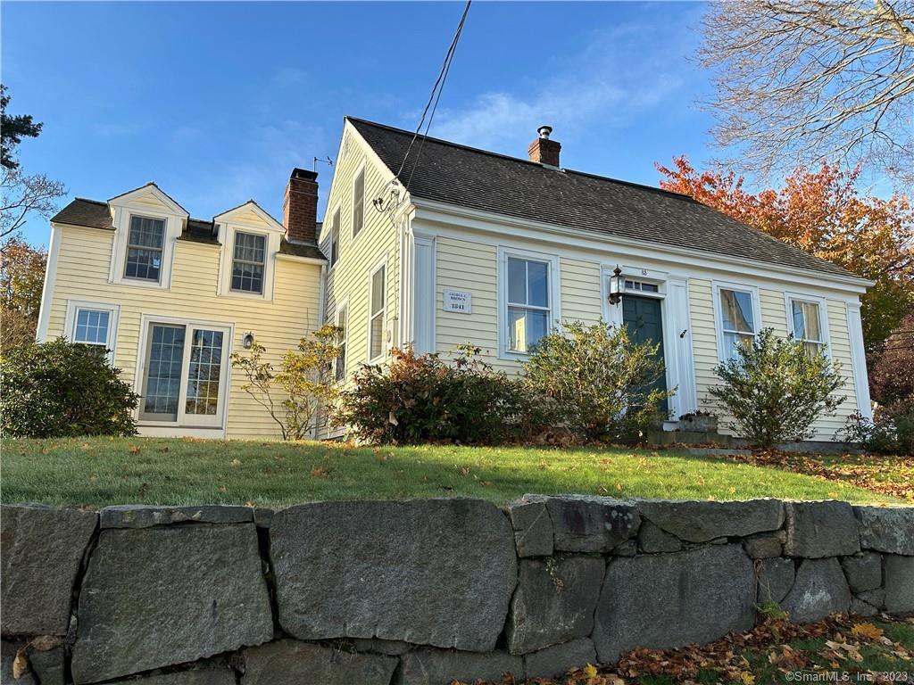 83 Front Street Groton, CT 06340 - Photo 1 of 1 a front view of a house with a yard