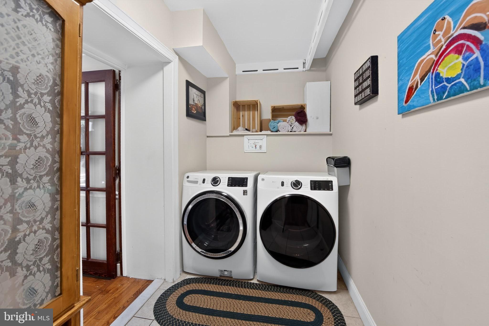 238 Brown Street Spring City, PA 19475 - Photo 16 of 57 Modern laundry space with vibrant art.