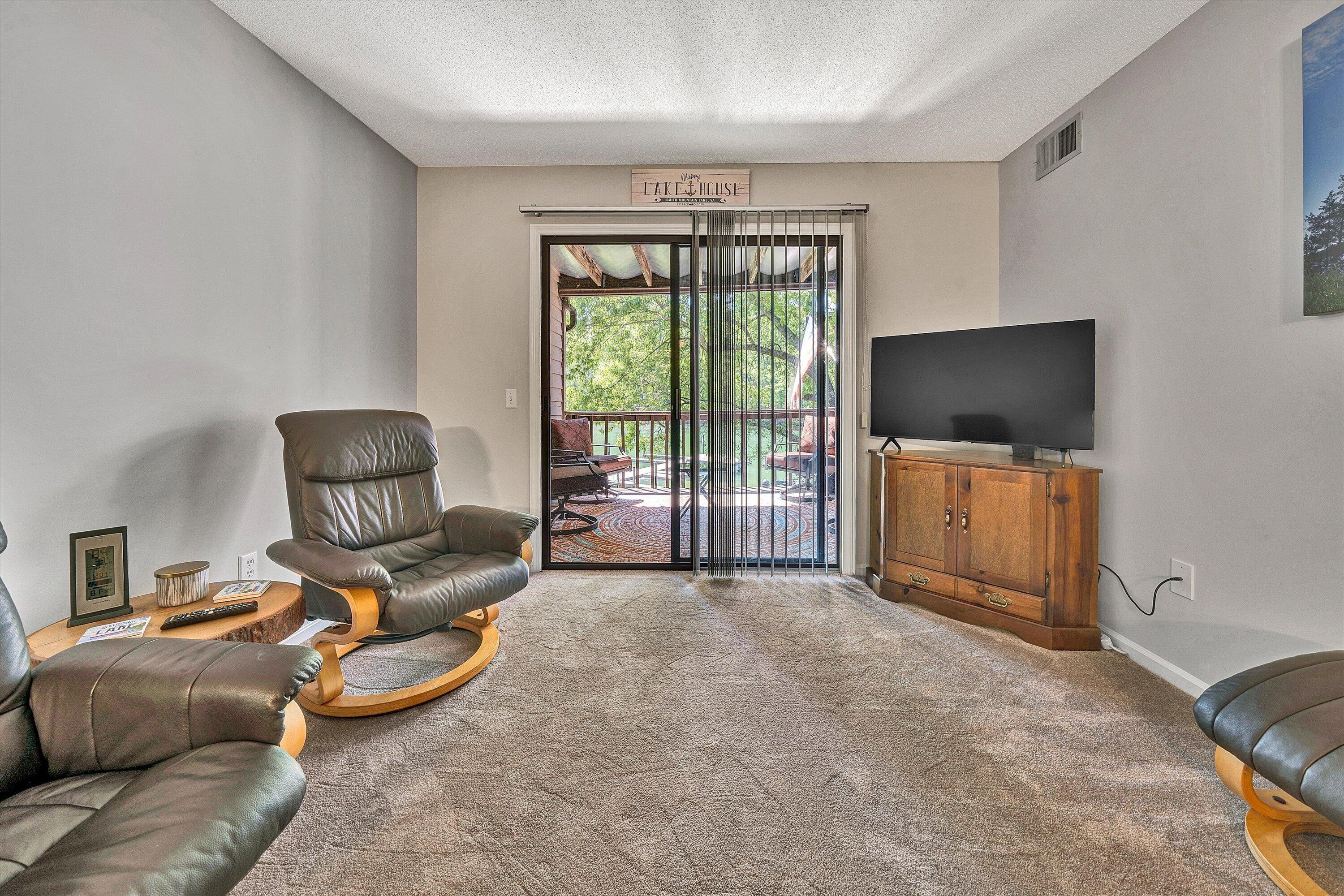 620 Monte Vista Road, Unit 605 Union Hall, VA 24176 - Photo 16 of 41 a living room with furniture and a flat screen tv