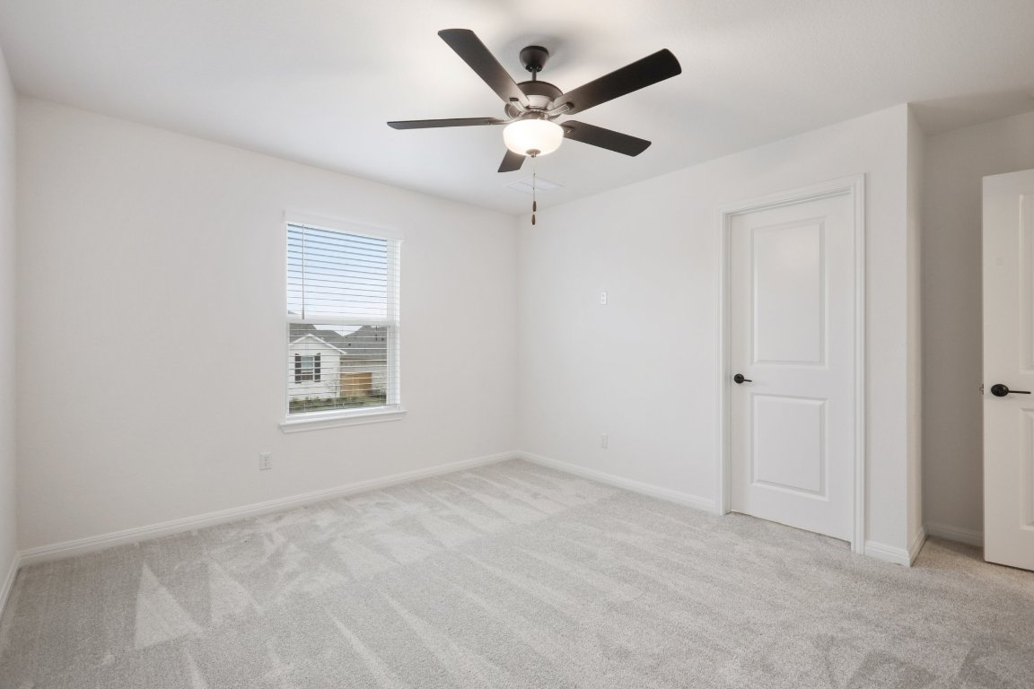 774 Jackson River Loop Kyle, TX 78640 - Photo 16 of 34 a view of an empty room with a window
