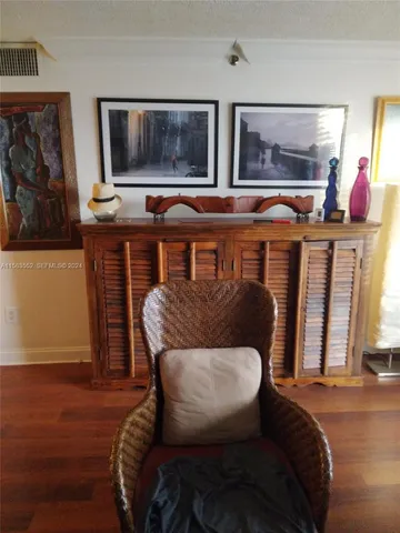 a balcony with furniture and wooden floor