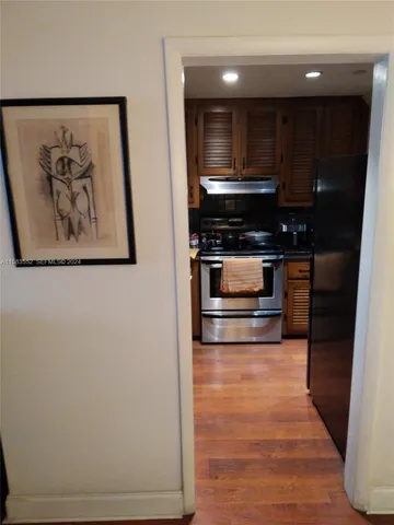 a hallway with washer and dryer