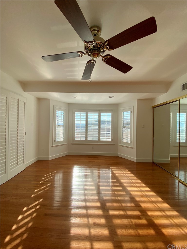 948 Cambridge Drive Burbank, CA 91504 - Photo 17 of 36 a view of an empty room with window and wooden floor