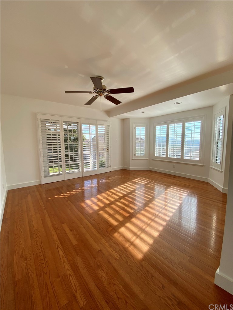 948 Cambridge Drive Burbank, CA 91504 - Photo 19 of 36 a view of an empty room with wooden floor and a window