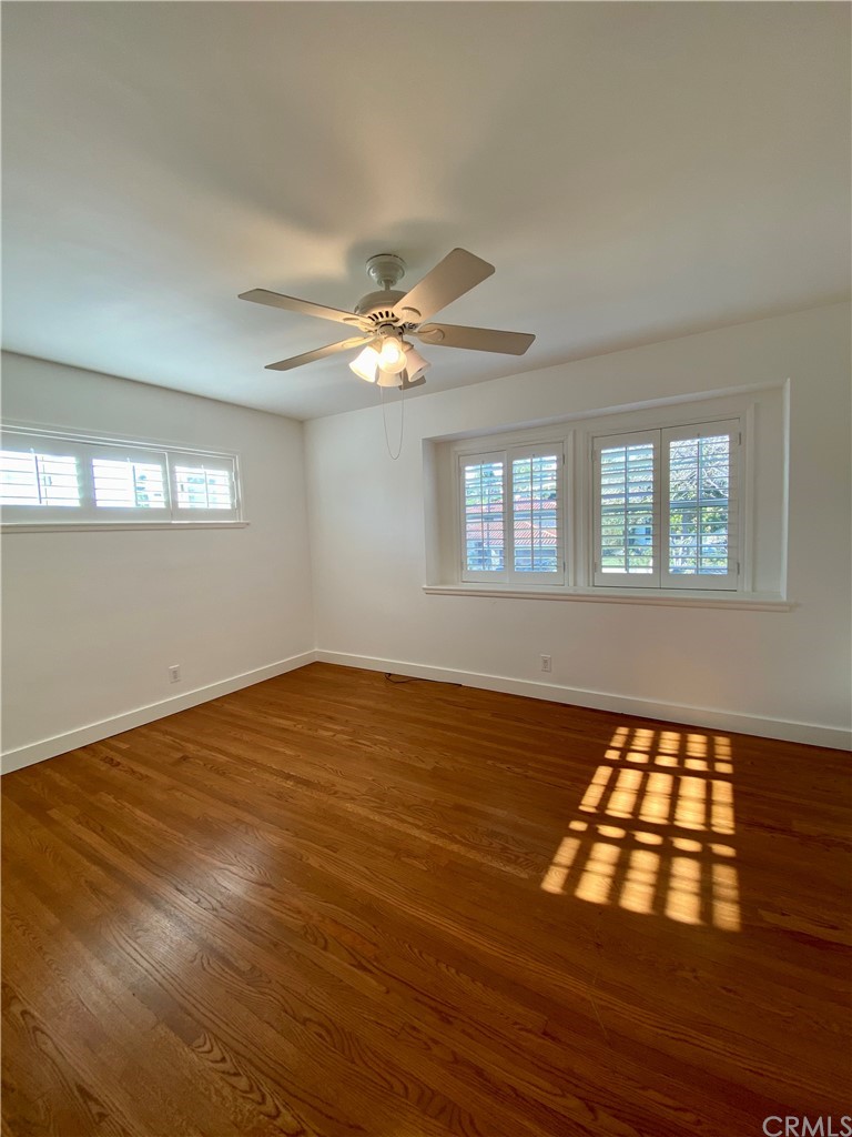 948 Cambridge Drive Burbank, CA 91504 - Photo 25 of 36 a view of an empty room with window and wooden floor