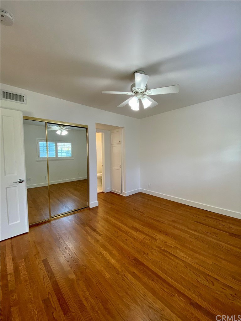 948 Cambridge Drive Burbank, CA 91504 - Photo 27 of 36 an empty room with wooden floor and window