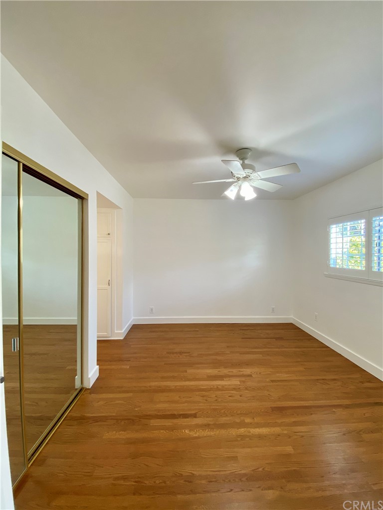 948 Cambridge Drive Burbank, CA 91504 - Photo 31 of 36 an empty room with wooden floor closet and windows