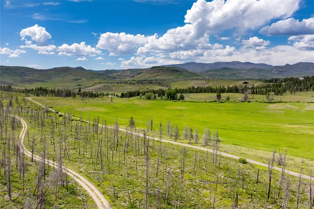 a view of an ocean and a mountain
