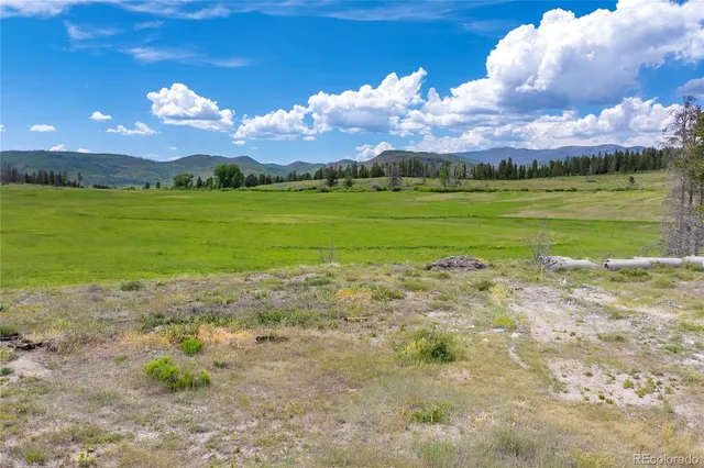 a view of a lake with a big yard