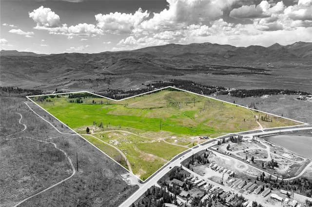 a view of a swimming pool with a yard
