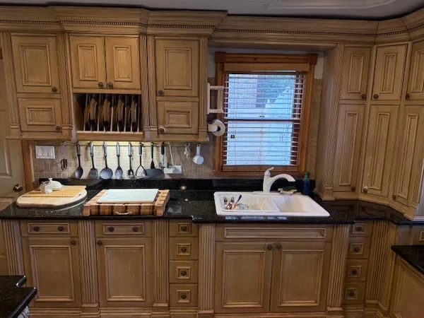 a kitchen with stainless steel appliances granite countertop a stove and a sink