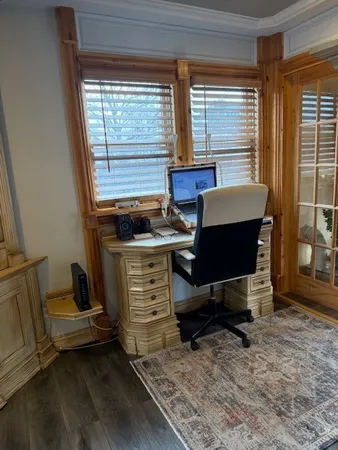 a living room with furniture a rug and a window