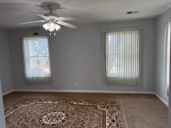 a view of a balcony with chairs