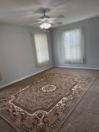 a view of a patio with a table chairs and barbeque